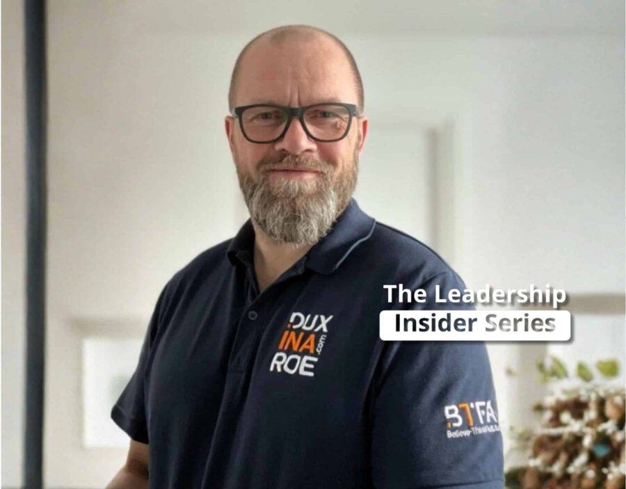A bearded man wearing glasses and a branded polo shirt stands indoors. The text on the image reads, "The Leadership Insider Series," exploring insights from neuroscience for effective leadership.